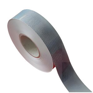 Roll of silver-white retro-reflective tape with a diamond pattern